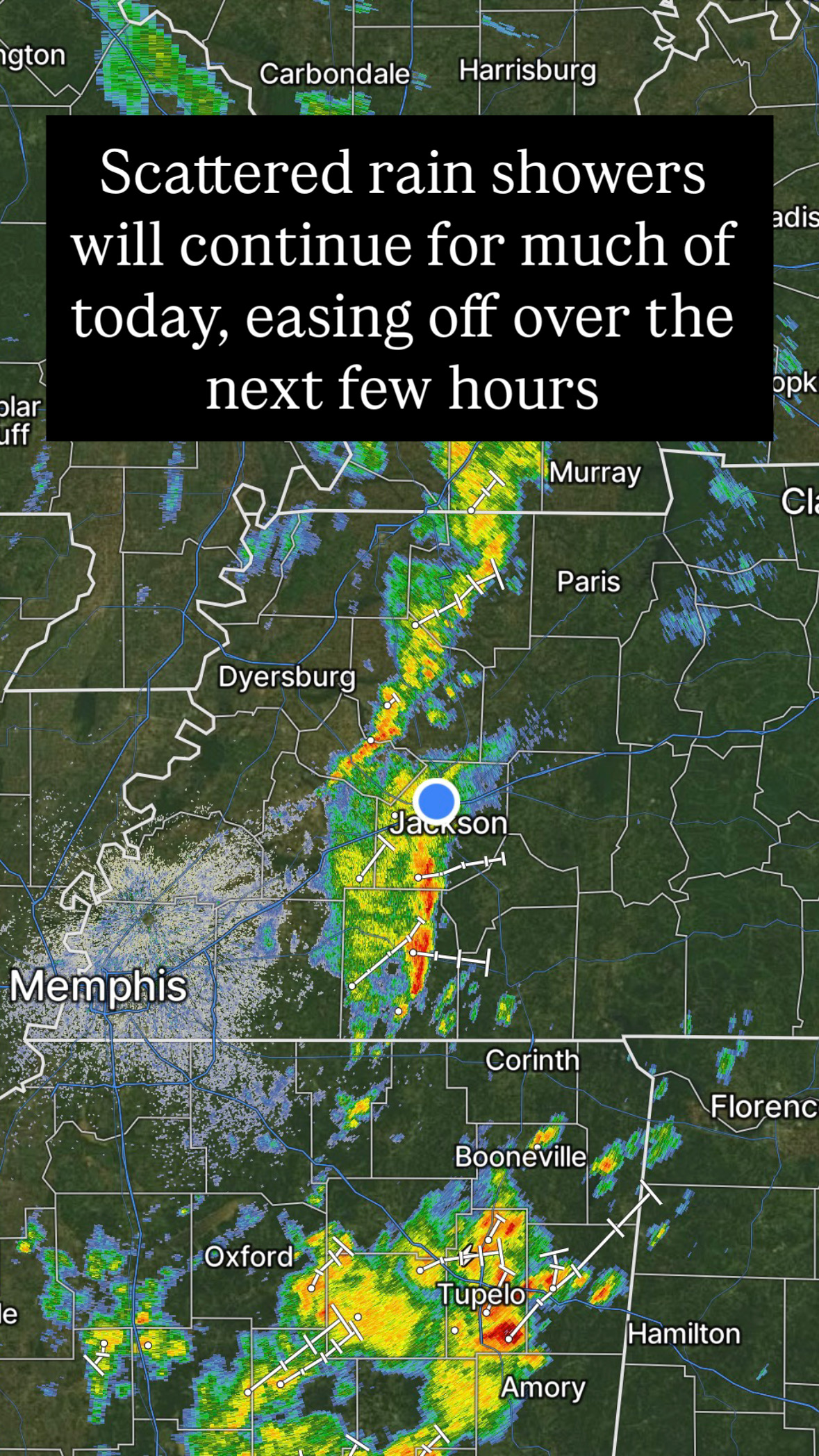 Scattered rain showers continuing through the day, easing over next few hours